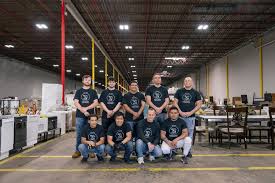 The Liquidation Warehouse team sorting pallets